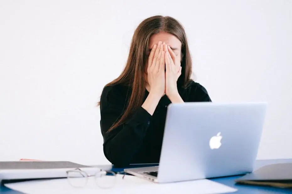 Frustrated person using laptop